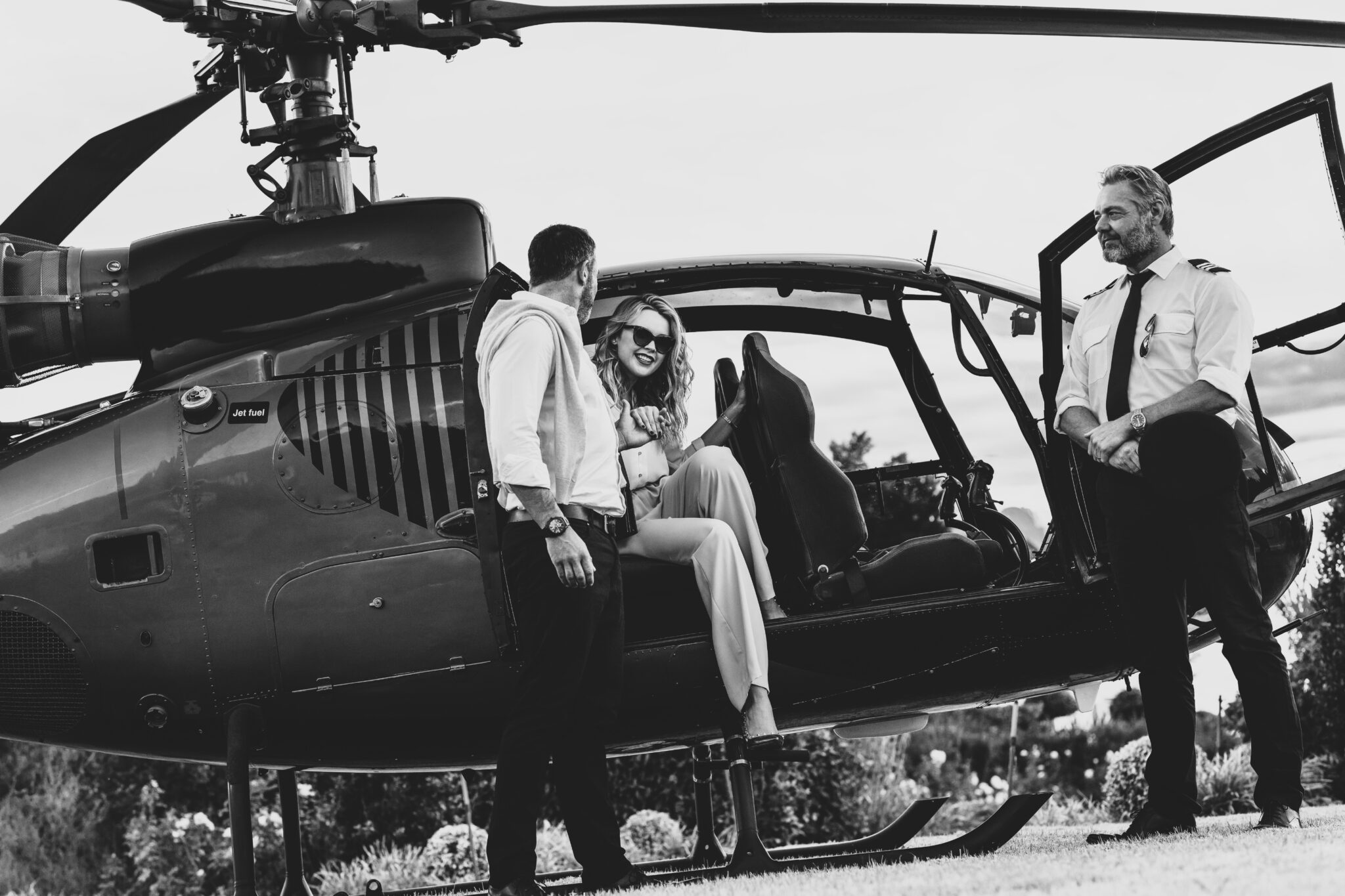 Couple traveling by a private helicopter